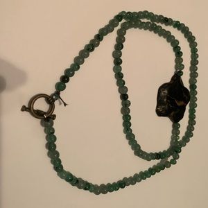 Green off-center necklace with black stone